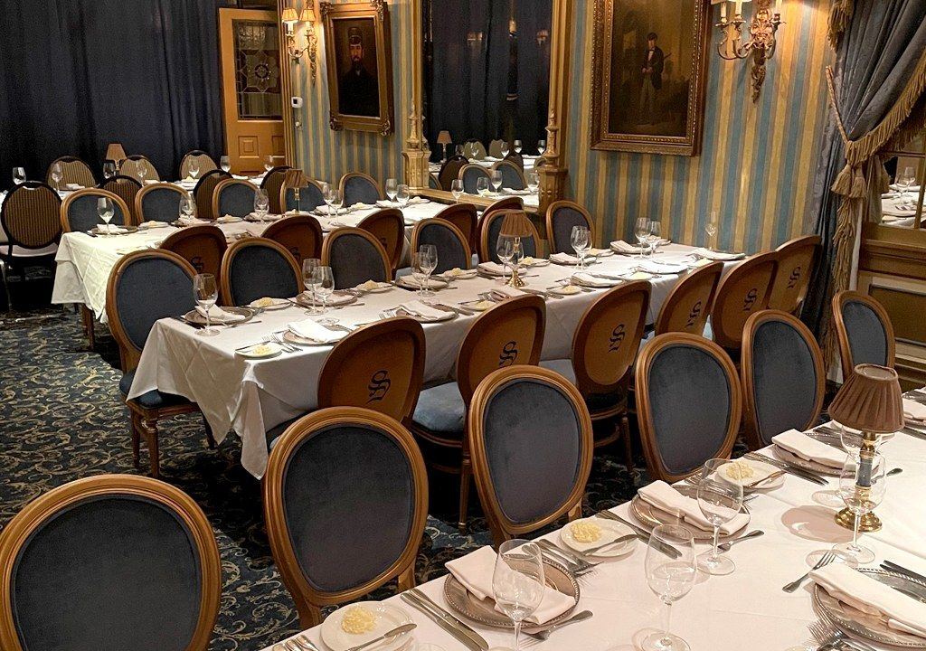 Embroidered Louis XVI dining chairs at The Sardine Factory restaurant in Monterey