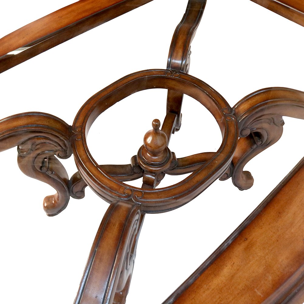 Close-up of a carved wood chair stretcher with a center finial
