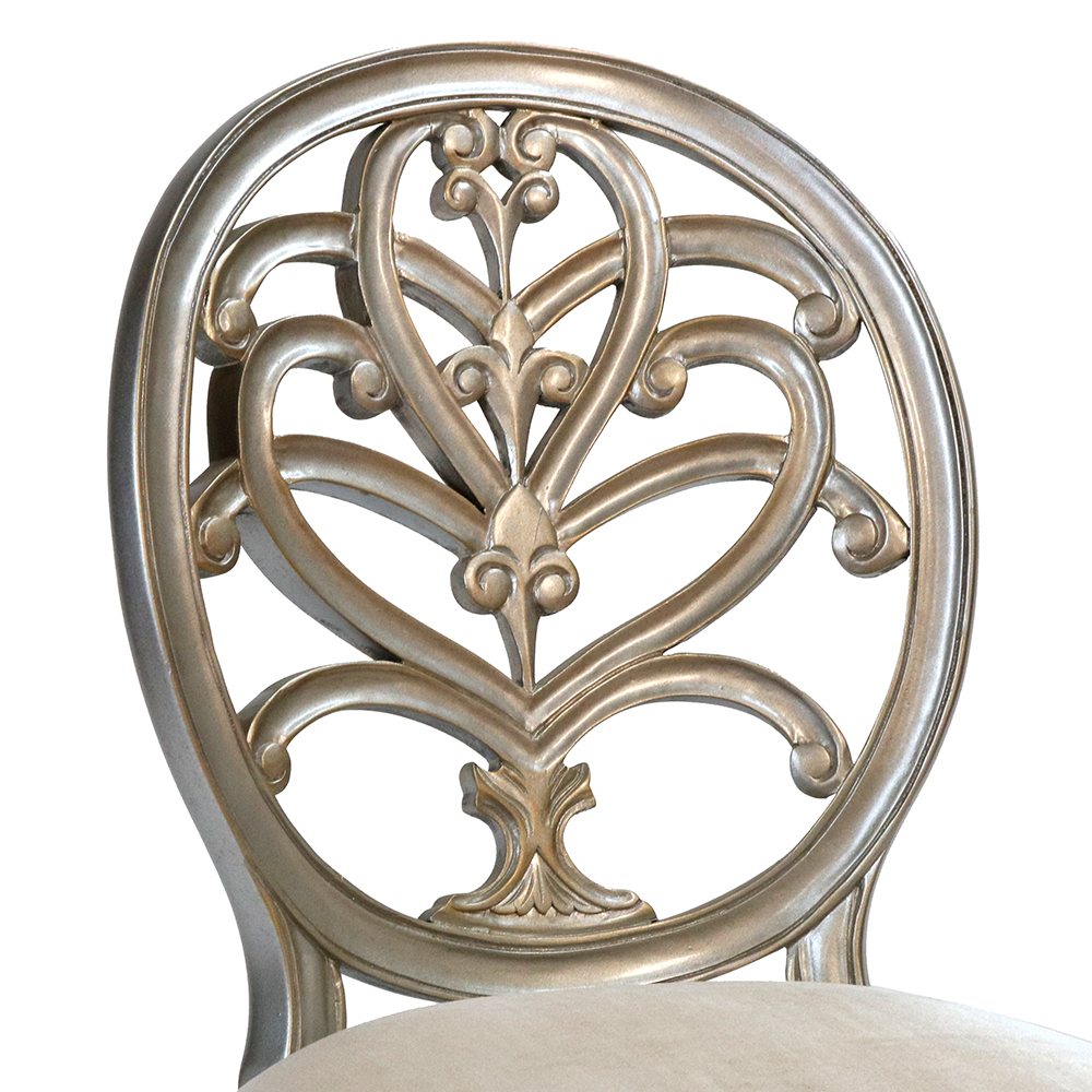 Close-up of a silver leaf carved chair back