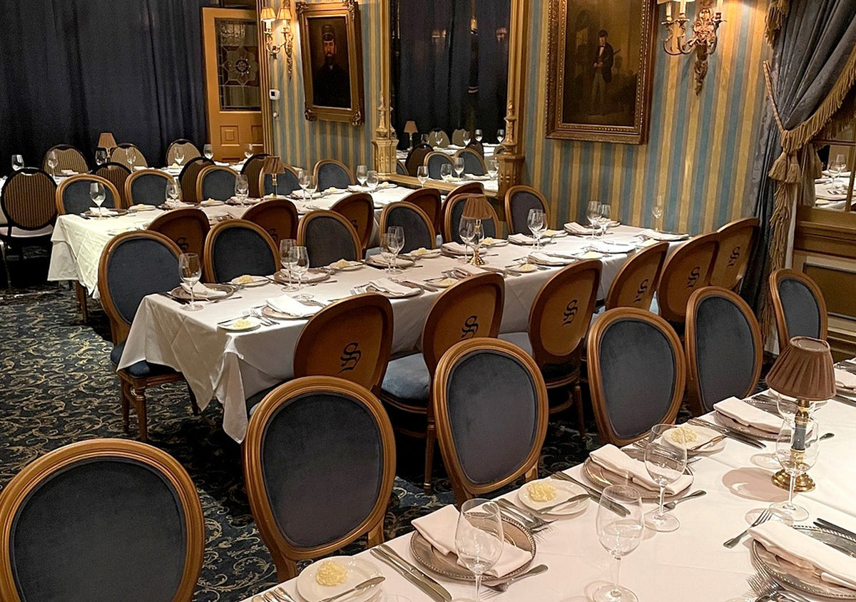 Banquet hall set with rows of Sigla oval-back dining chairs