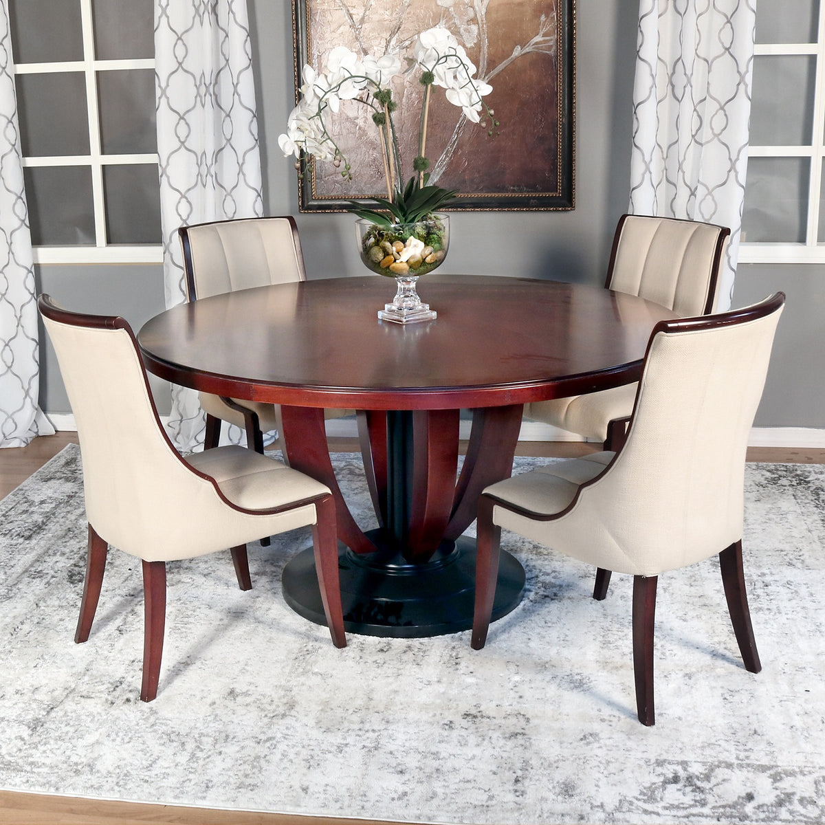 Round dining table set with upholstered chairs
